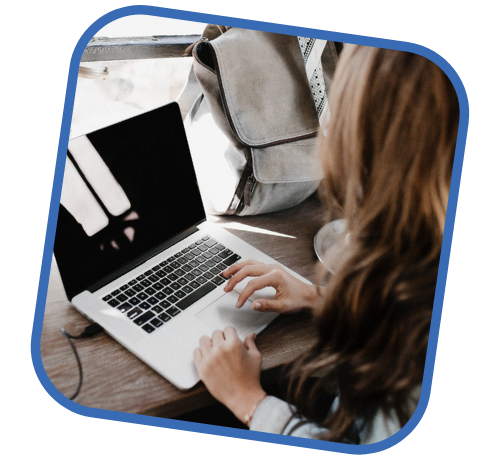 woman in cafe working on laptop